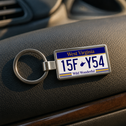 West Virginia license plate keychain on car dashboard