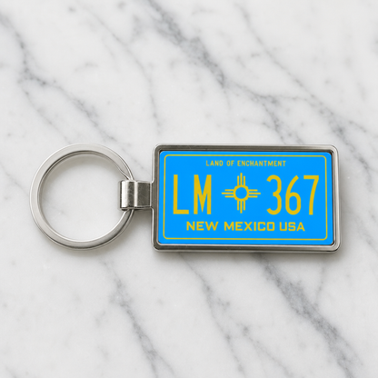 New Mexico LM 367 license plate keychain on_marble