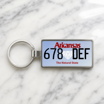 Arkansas 678 DEF license plate keychain on_marble