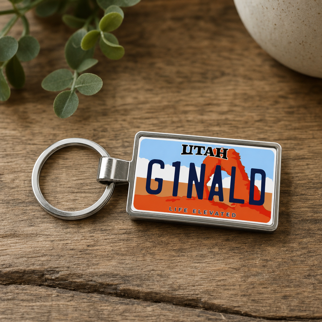 Utah license plate keychain on wood