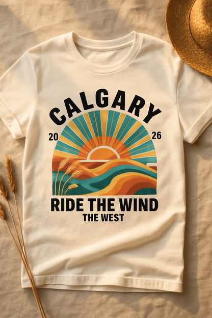 Prairie Sun Calgary 2026 white t-shirt flat-lay on linen with wheat stalks and straw hat