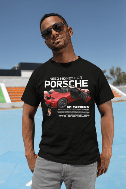 Man wearing Need Money For Porsche 911 Carrera GTS Cabriolet graphic t-shirt in black, standing outdoors.